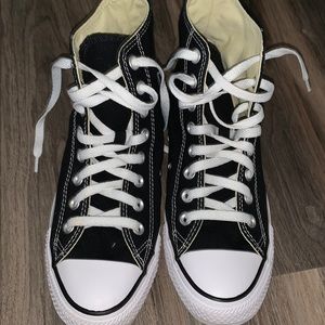 Women’s size 9 black high top converse.
